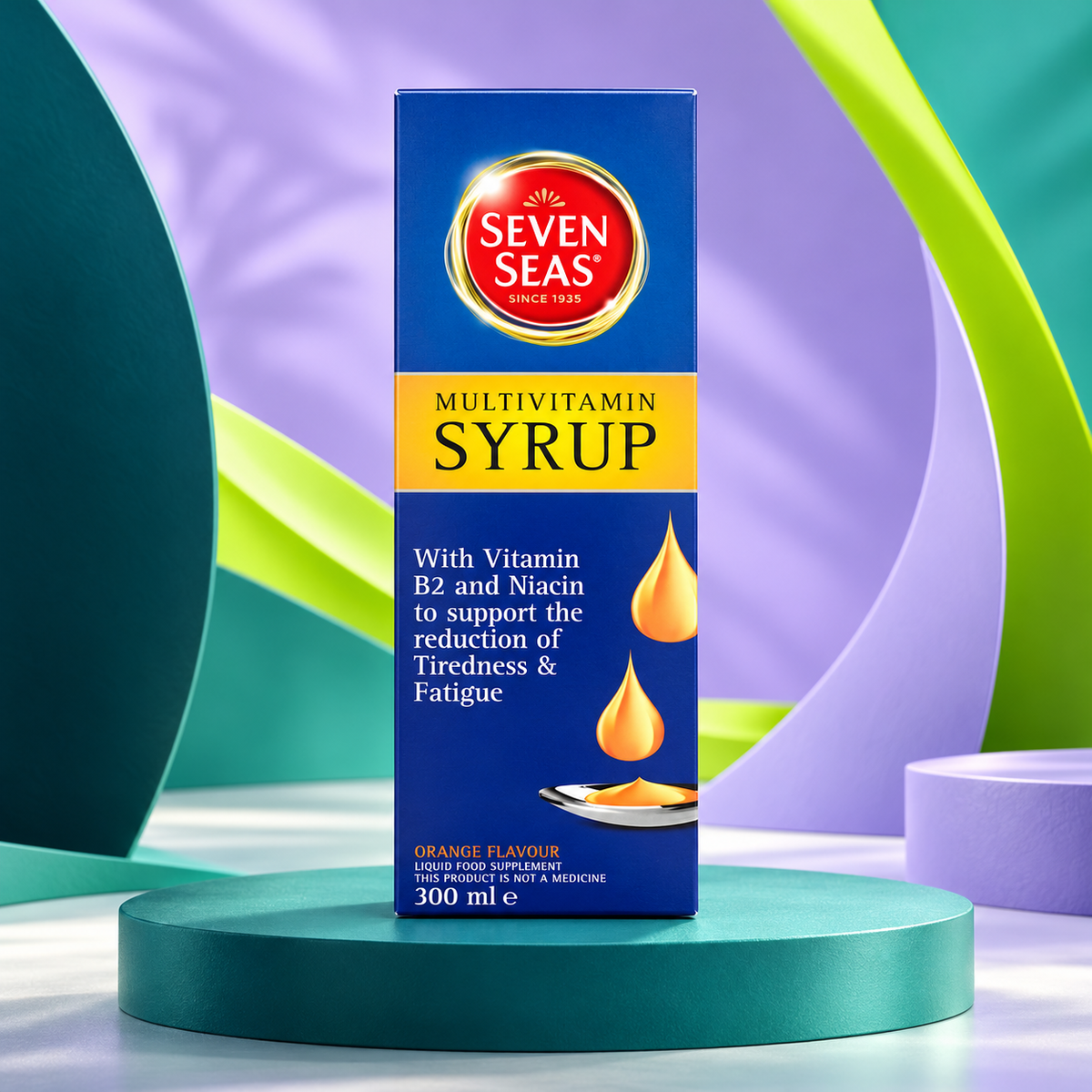 Seven Seas Syrup package shown on a sculpted teal studio display.